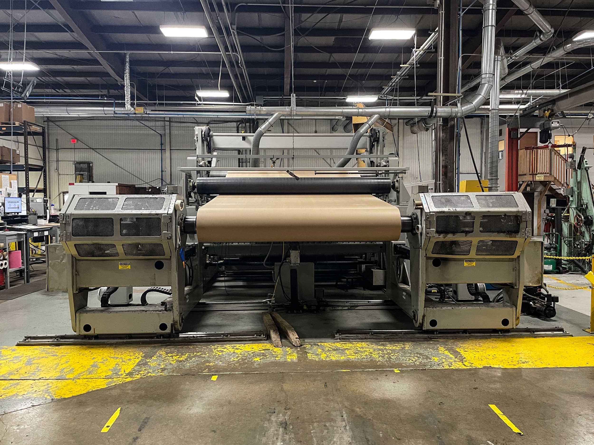 Paper web threaded through converting equipment at Paper Dimensions