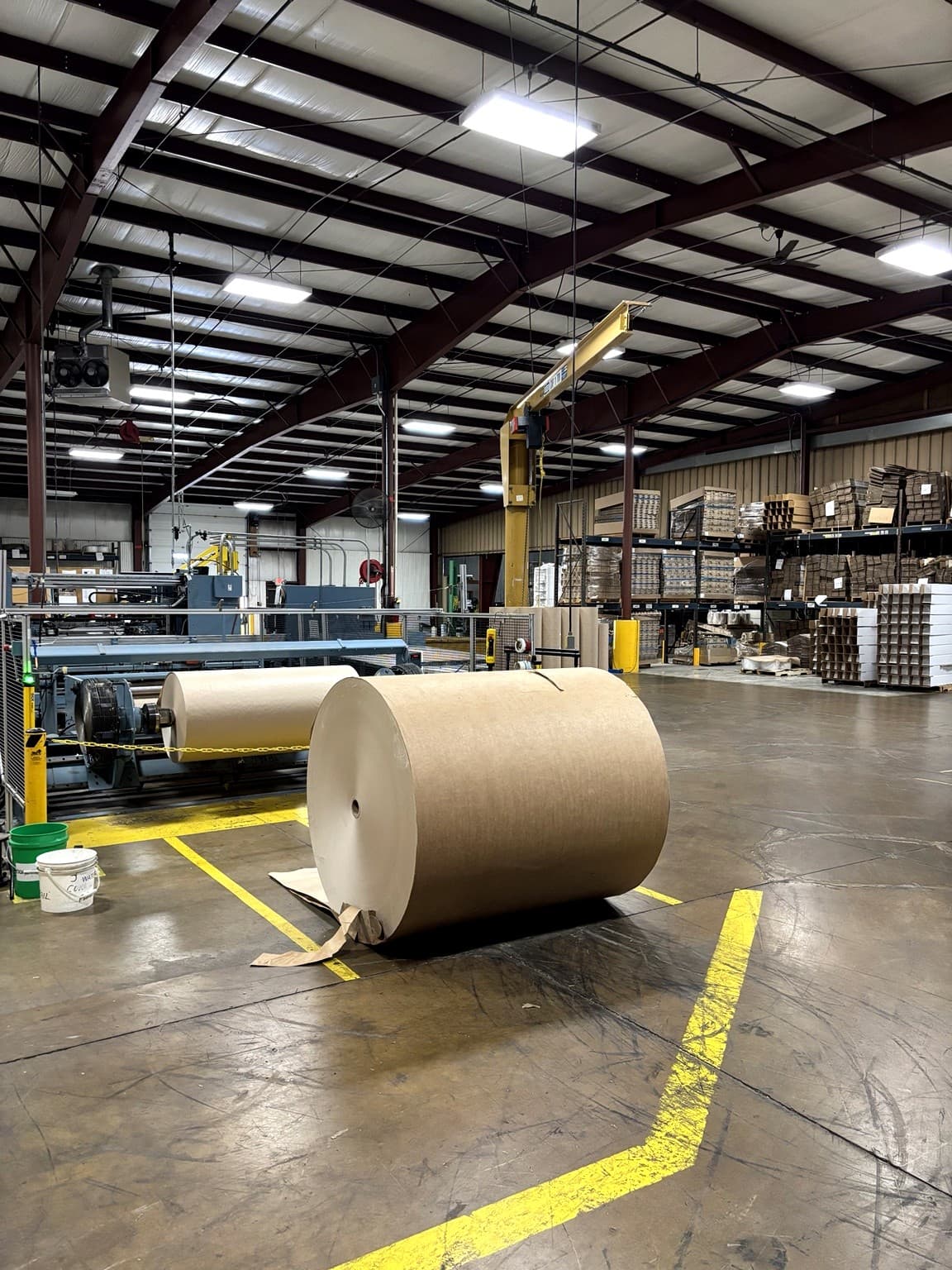 Jumbo parent paper roll staged on the production floor at Paper Dimensions before slitting