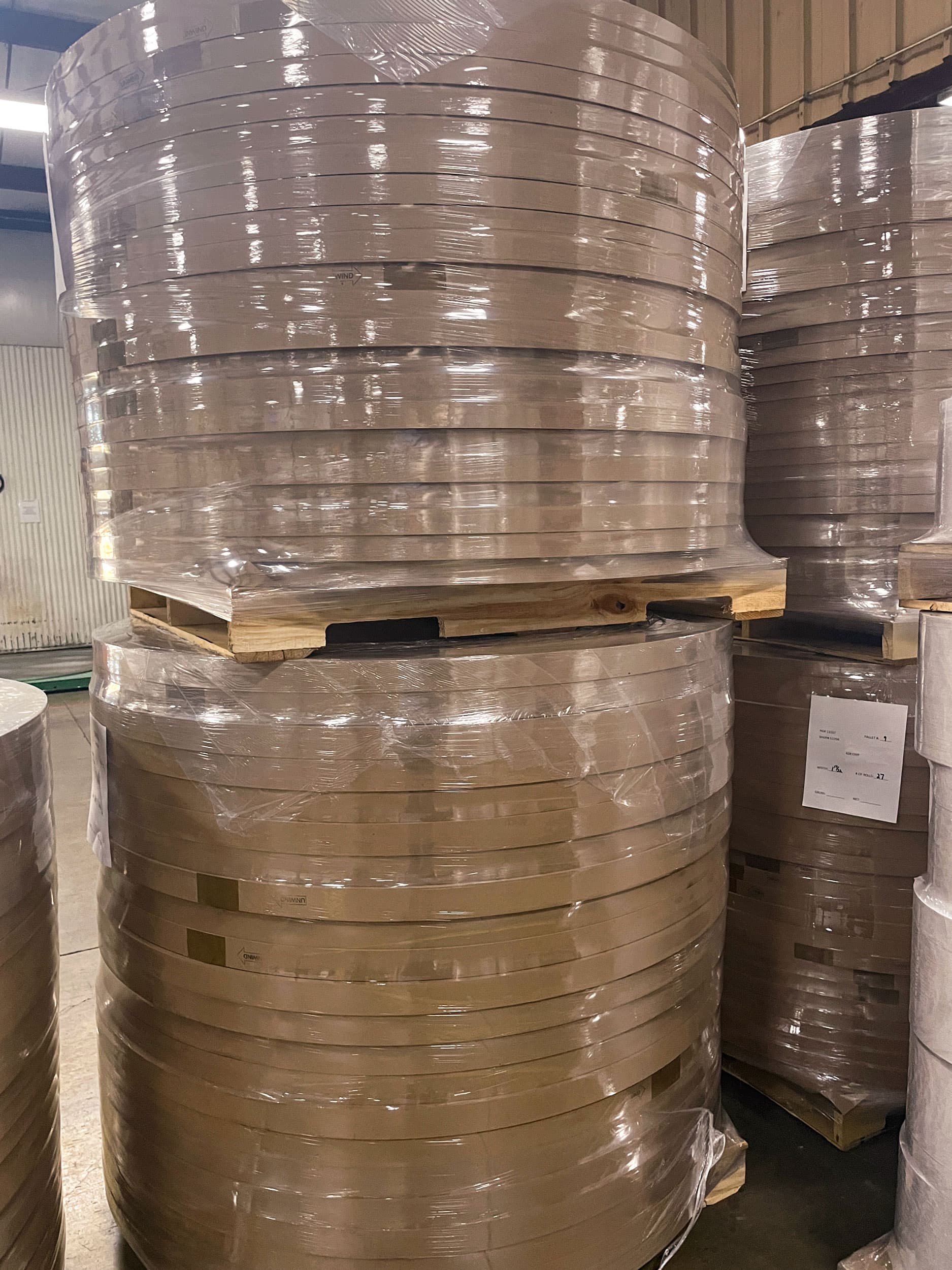 Finished slit paper rolls wrapped and palletized at Paper Dimensions