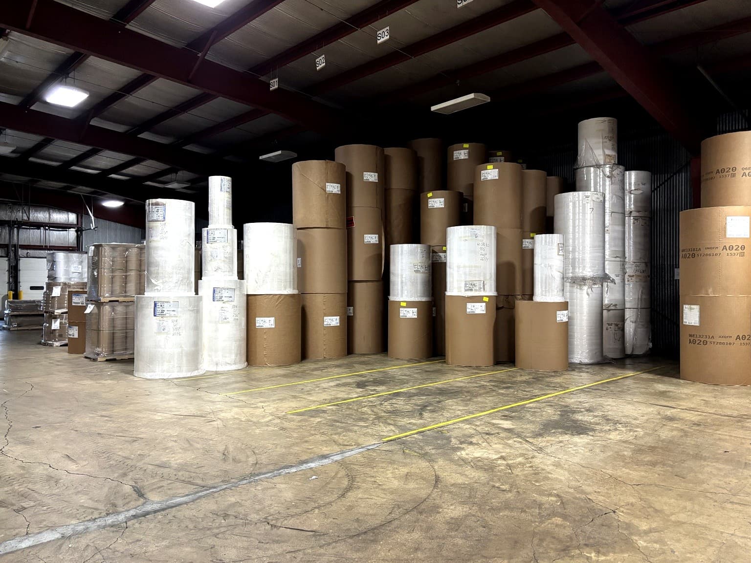 Parent paper rolls stored in the Paper Dimensions warehouse in Beaver Dam, Wisconsin, used for customer-owned inventory programs